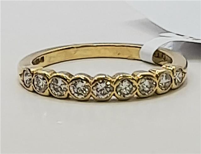 18ct diamond ring in size N with sparkling diamonds, featuring a sleek band design, unbranded jewelry piece.