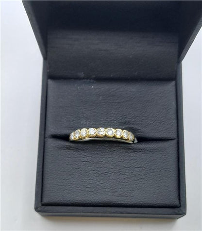 18ct diamond ring in size N with sparkling diamonds, unbranded jewelry piece featuring elegant design and fine craftsmanship.