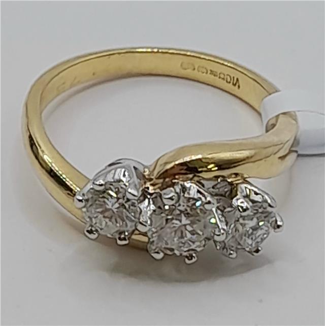 18ct gold diamond ring with 0.75 carats, size L, featuring a sparkling diamond setting and a sleek gold band.