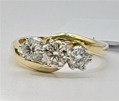 18ct gold diamond ring with 0.75 carats, size L, featuring sparkling diamonds on a sleek band.