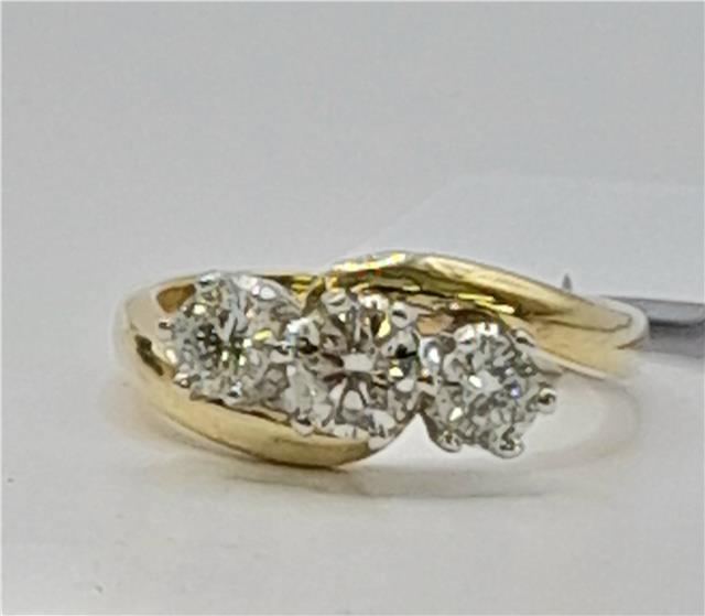 18ct gold diamond ring with 0.75ct center stone, size L, featuring a sleek band and sparkling diamonds.