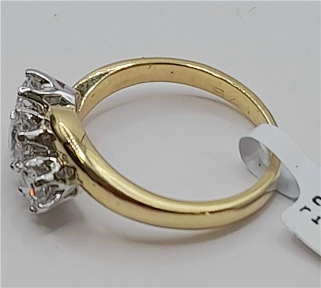18ct gold diamond ring with 0.75 carats, size L, featuring a sparkling diamond centerpiece on a sleek band.