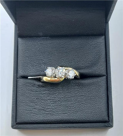 18ct gold diamond ring with 0.75 carats, size L, featuring a sparkling diamond centerpiece and a sleek gold band.