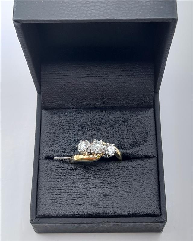 18ct gold diamond ring with 0.75 carats, size L, featuring a sleek design and sparkling diamonds, unbranded.