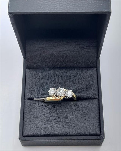 18ct gold diamond ring with 0.75 carats, size L, featuring a sleek design and sparkling diamonds, unbranded.
