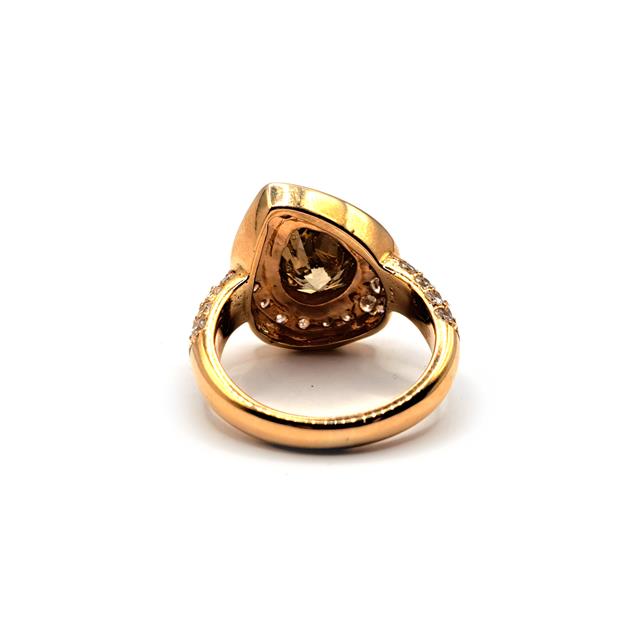 18ct rose gold brown diamond ring with a 2.65 carat pear-shaped brown diamond, elegant unbranded jewelry piece.