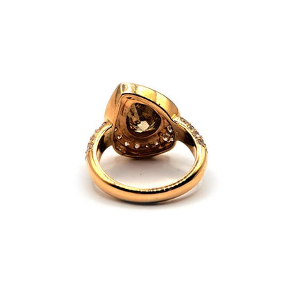 18ct rose gold brown diamond ring with a 2.65 carat pear-shaped brown diamond, elegant unbranded jewelry piece.