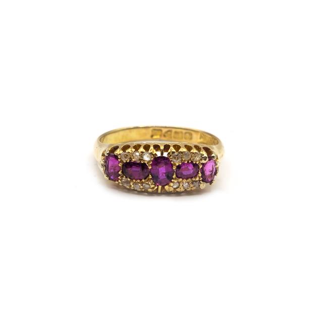 18ct ruby and diamond ring featuring a central ruby gemstone surrounded by sparkling diamonds, set in a sleek band.