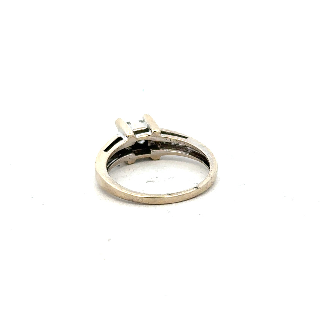 18ct white gold diamond ring with 0.33 carats, size L, featuring a sleek band and sparkling diamonds.