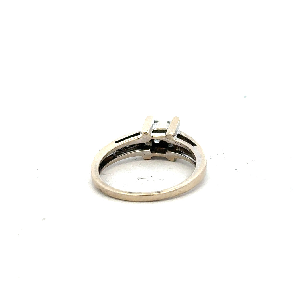18ct white gold diamond ring with 0.33 carats, size L, featuring a sleek design and sparkling diamonds.
