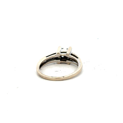 18ct white gold diamond ring with 0.33 carats, size L, featuring a sleek design and sparkling diamonds.