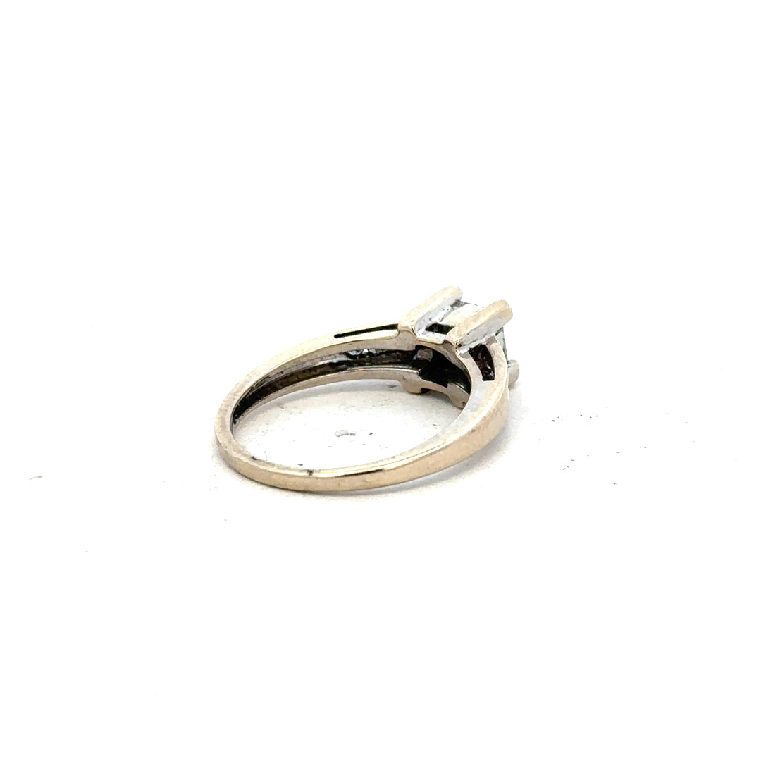 18ct white gold diamond ring with 0.33 carats, size L, featuring a delicate band and sparkling diamonds.