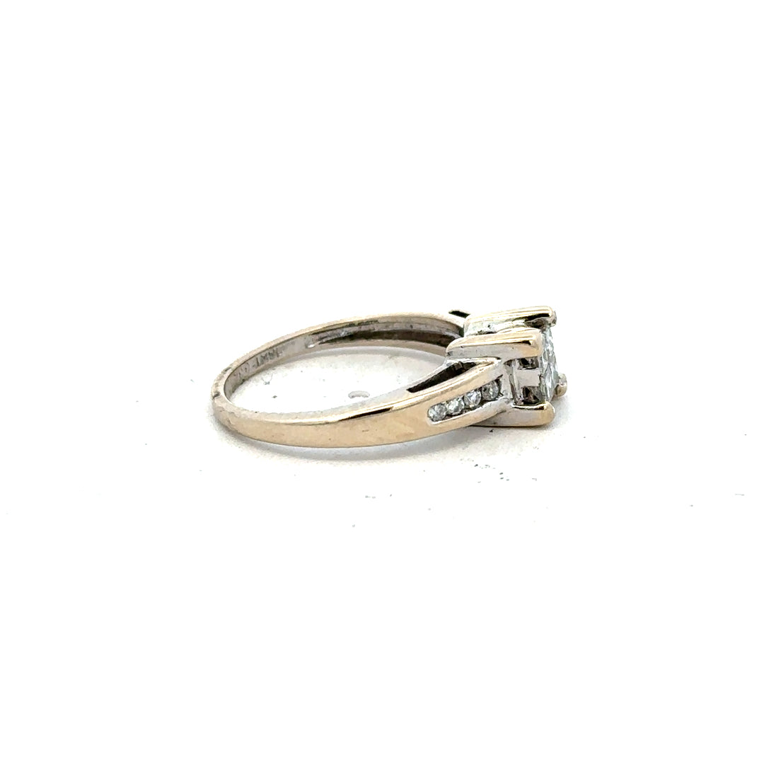 18ct white gold diamond ring with 0.33 carats, size L, featuring a sleek design and sparkling diamonds.