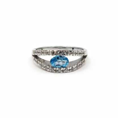 18ct white gold ring with a 0.40 carat topaz and 0.45 carat diamond accent, showcasing elegant jewelry design.