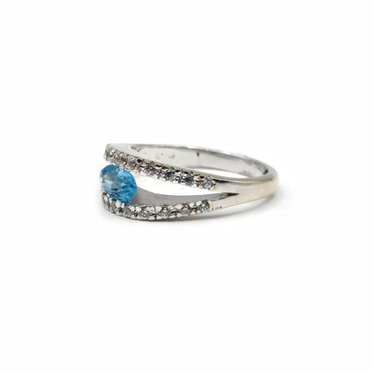 18ct white gold ring with a 0.40 carat topaz and 0.45 carat diamond accent, featuring a sleek, elegant design.