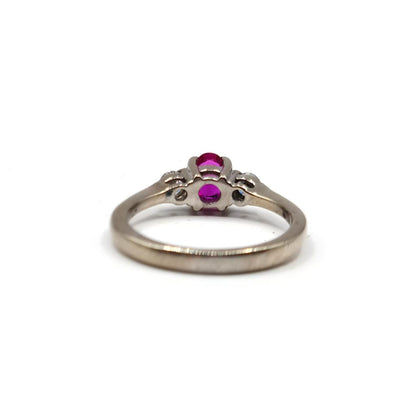 18ct white gold ring with a 0.55 carat ruby and 0.20 carat diamond, designed in an elegant jewelry style.