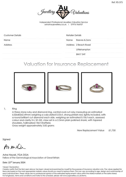 18ct white gold ring with a 0.55 carat ruby and 0.20 carat diamond accents, showcasing elegant jewelry design.