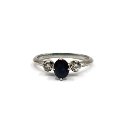 18ct white gold ring featuring a 0.70 carat sapphire center stone and smaller 0.30 carat sapphires, elegant jewelry design