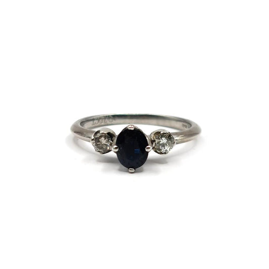 18ct white gold ring featuring a 0.70 carat sapphire center stone and smaller 0.30 carat sapphires, elegant jewelry design