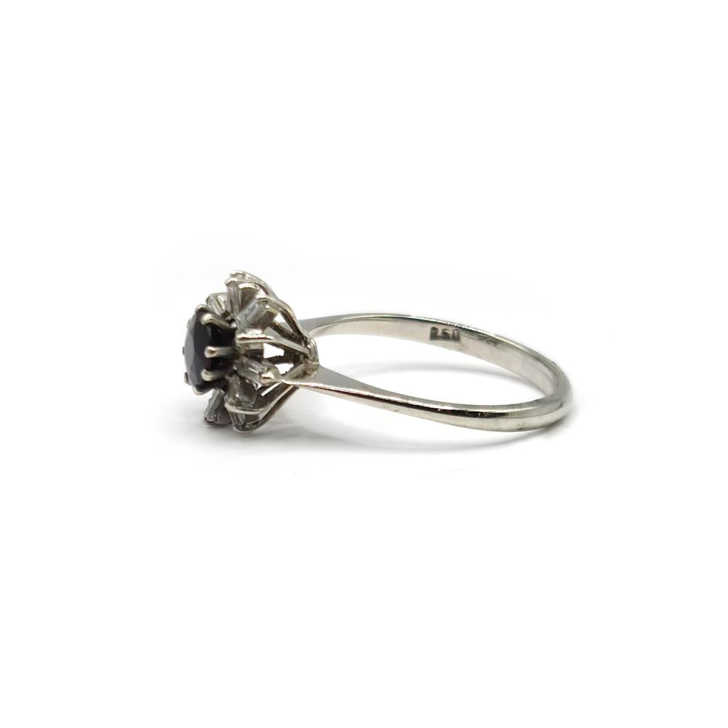 18ct white gold diamond cluster ring with 0.81 carats of sparkling diamonds, showcasing an elegant jewelry piece.