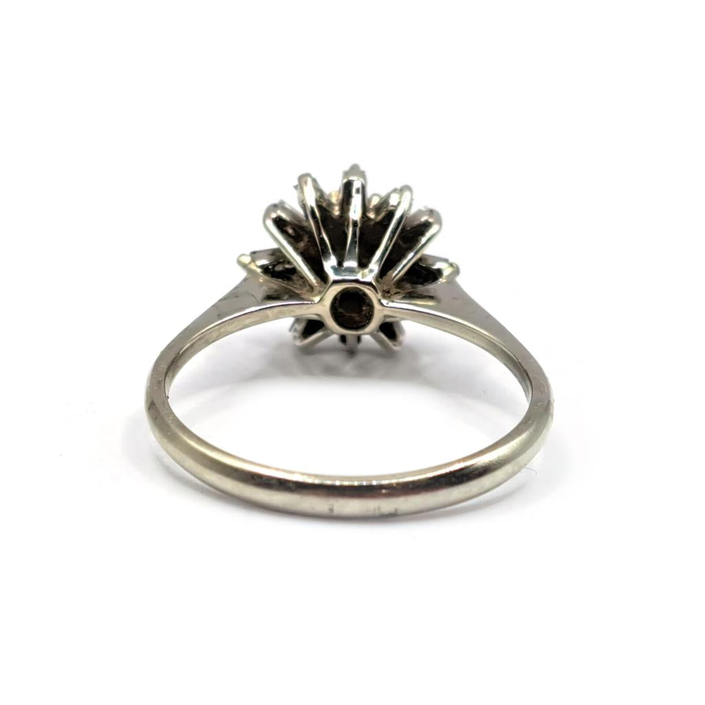 18ct white gold diamond cluster ring featuring 0.81 carats of sparkling diamonds, elegant jewelry piece with a classic design