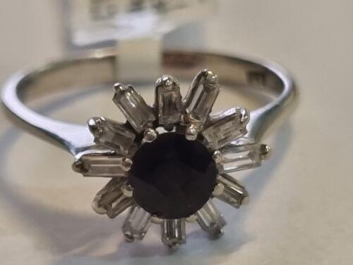18ct white gold diamond cluster ring with 0.81 carats of sparkling diamonds, showcasing an elegant and intricate design.
