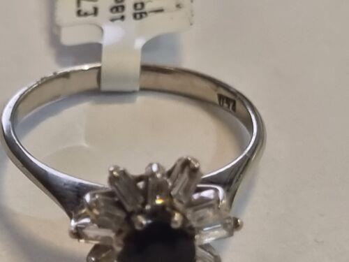 18ct white gold diamond cluster ring with 0.81 carats of sparkling diamonds, featuring a elegant and intricate design.