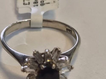 18ct white gold diamond cluster ring with 0.81 carats of sparkling diamonds, featuring a elegant and intricate design.