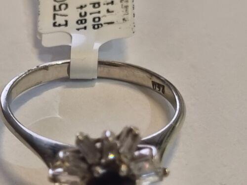 18ct white gold diamond cluster ring with 0.81 carats of sparkling diamonds, featuring a classic and elegant design.