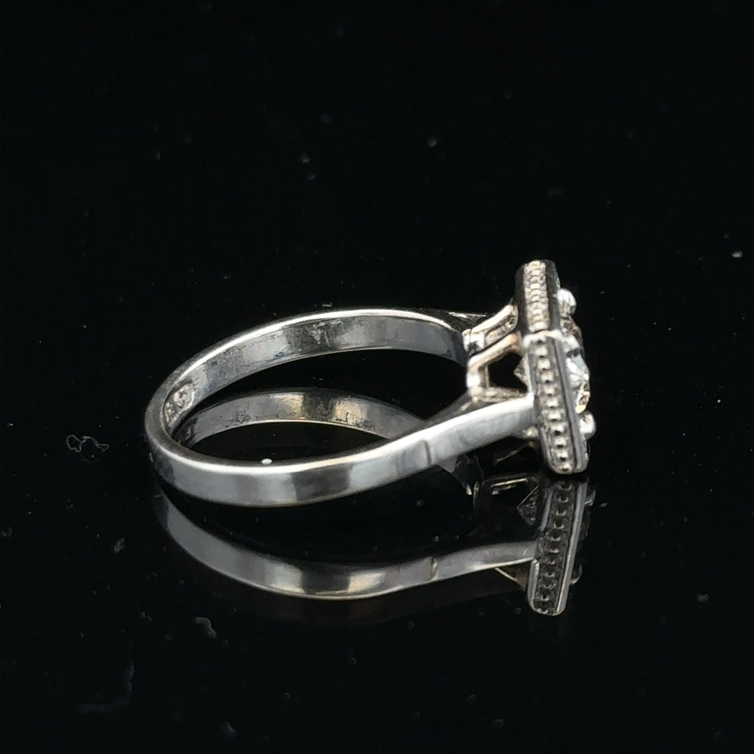 18ct white gold diamond ring with 0.89ct diamonds, size L, 3.9g, featuring a sleek band and sparkling gemstone details.