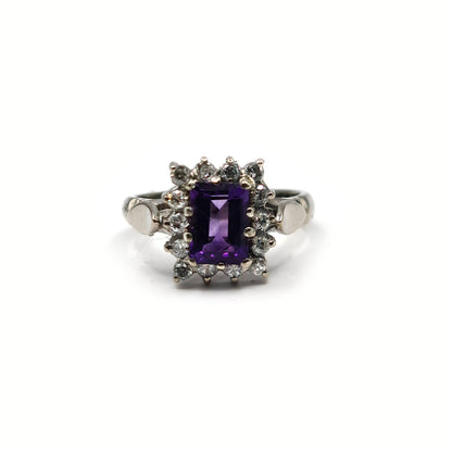 18ct white gold ring featuring a 1.05 carat emerald cut amethyst and 0.30 carat diamonds, showcasing elegant jewelry design.