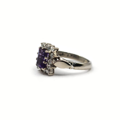 18ct white gold ring with a 1.05 carat emerald cut amethyst and 0.30 carat diamond accents, showcasing elegant gemstone details.
