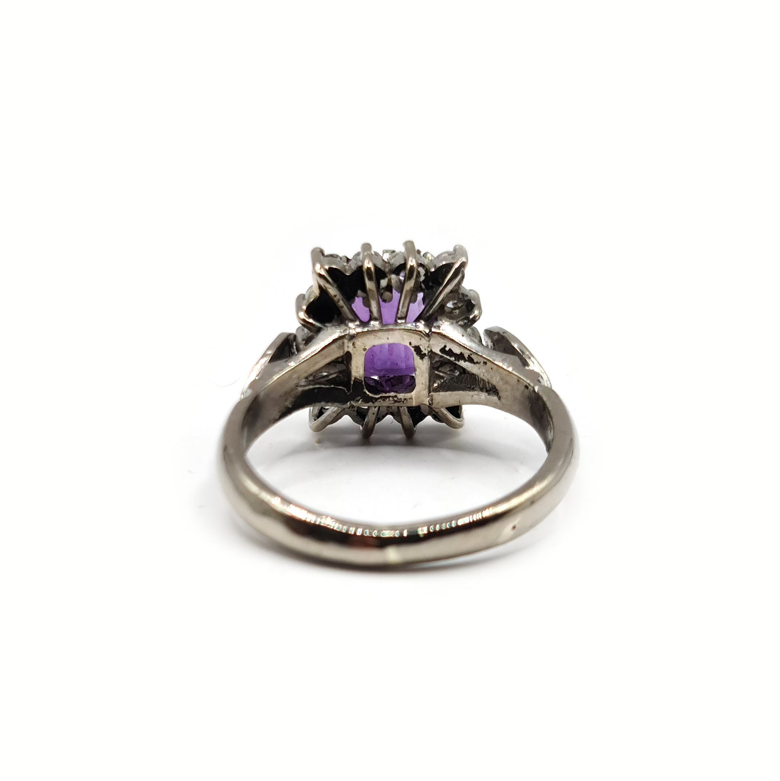 18ct white gold ring featuring a 1.05 carat emerald cut amethyst with 0.30 carat diamonds, showcasing elegant jewelry design.