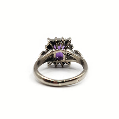 18ct white gold ring featuring a 1.05 carat emerald cut amethyst with 0.30 carat diamonds, showcasing elegant jewelry design.