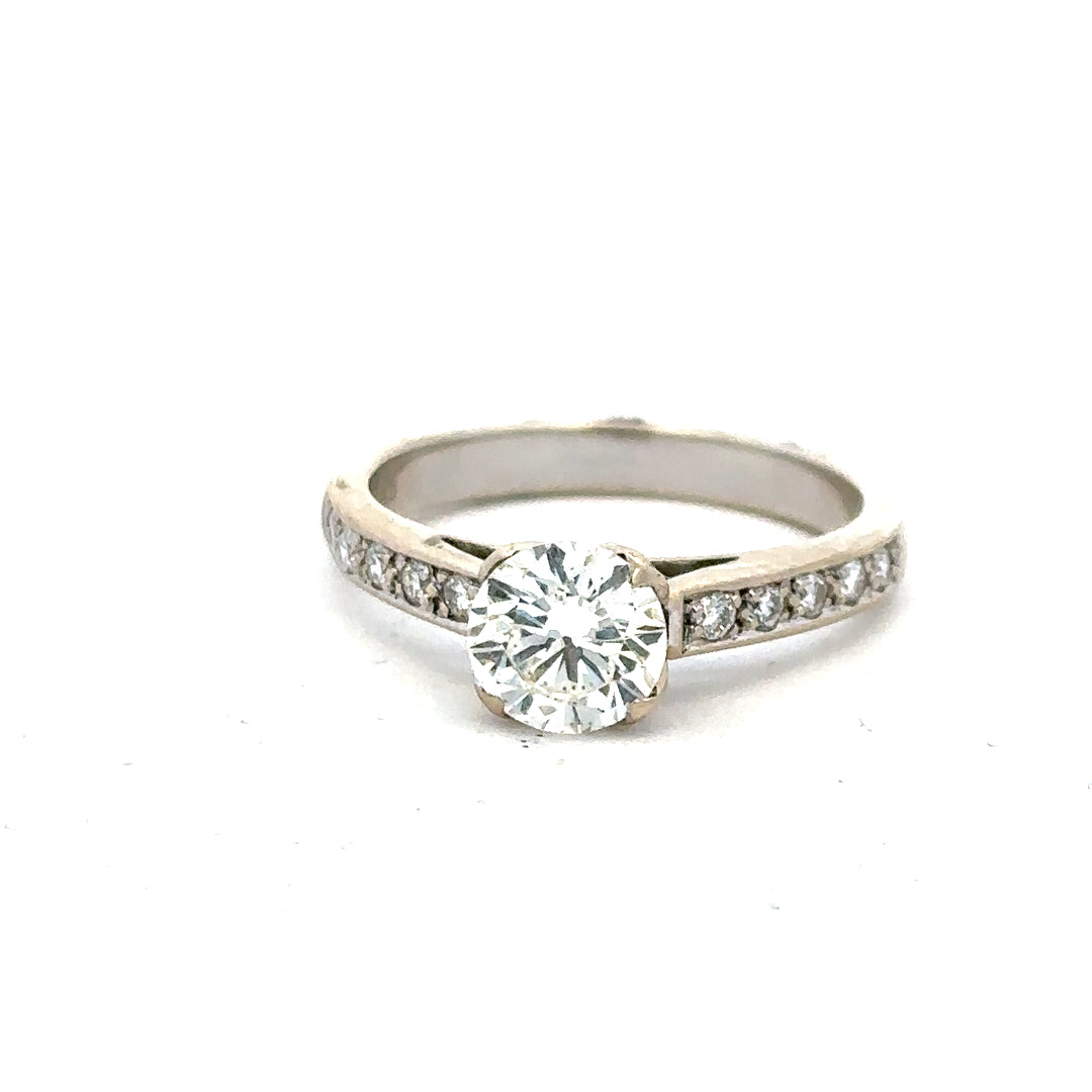 18ct white gold diamond ring with 1.135 carats, color I, clarity SI1, featuring a sparkling central diamond.