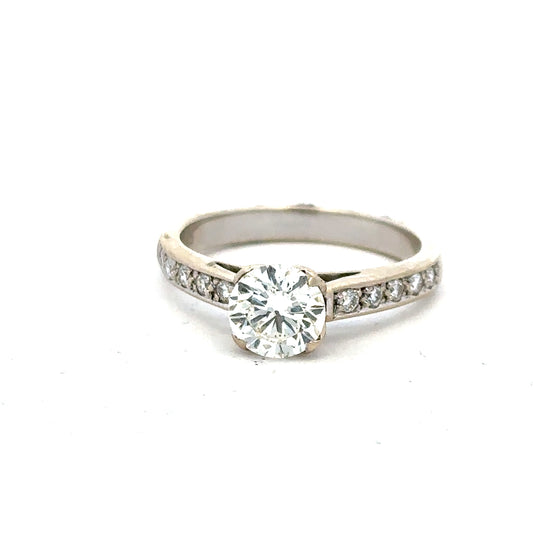 18ct white gold diamond ring with 1.135 carats, color I, clarity SI1, featuring a sparkling central diamond.