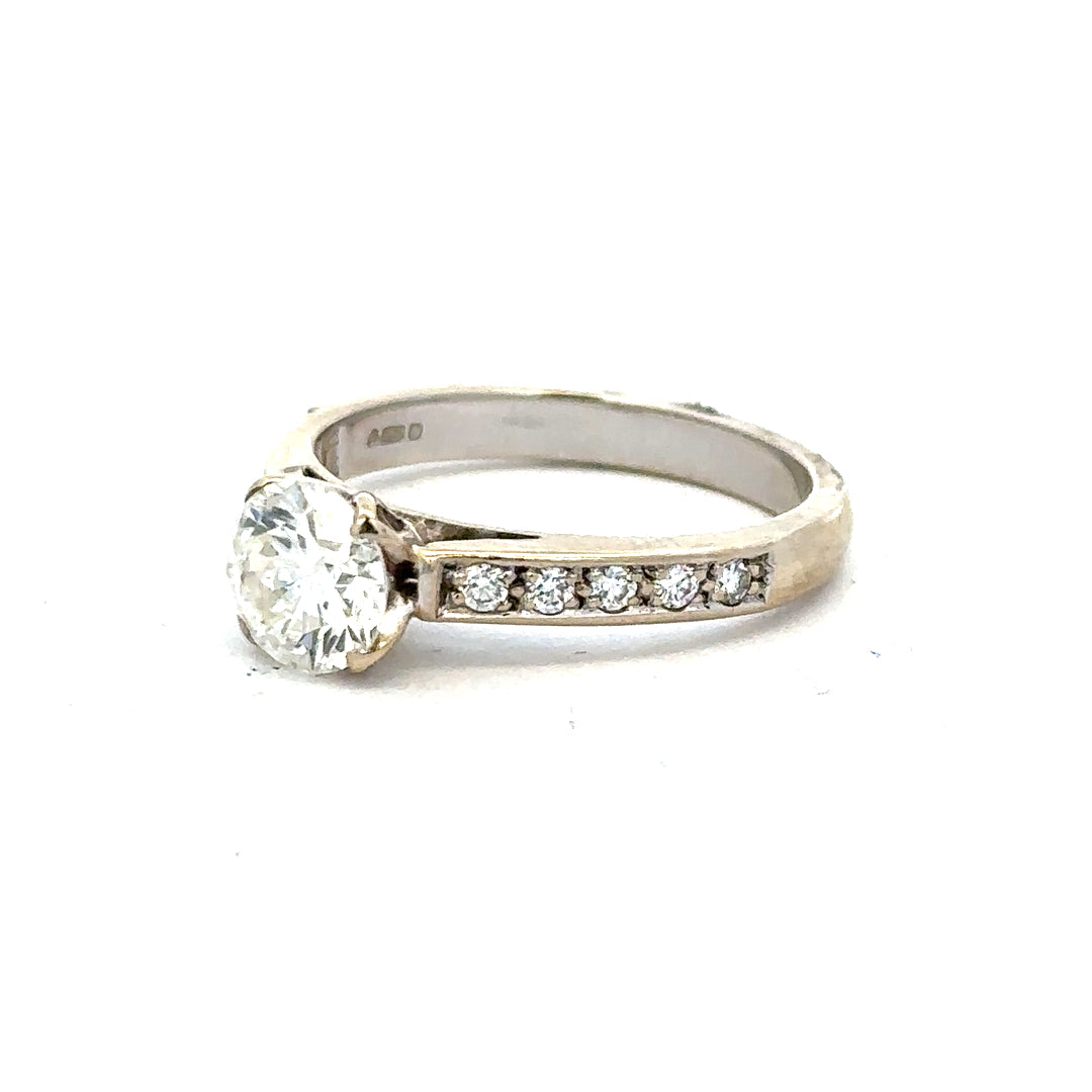 18ct white gold diamond ring with 1.135 carats, Colour I, Clarity SI1, featuring a sparkling central diamond.