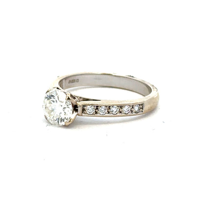 18ct white gold diamond ring with 1.135 carats, Colour I, Clarity SI1, featuring a sparkling central diamond.