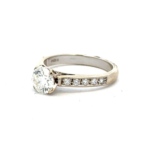 18ct white gold diamond ring with 1.135 carats, Colour I, Clarity SI1, featuring a sparkling central diamond.