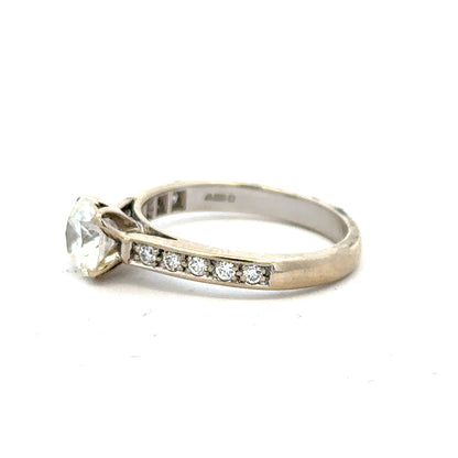 18ct white gold diamond ring with 1.135 carats, Colour I, Clarity SI1, featuring a sparkling central diamond design.