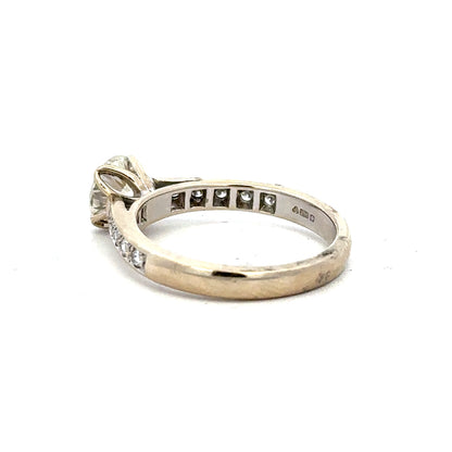 18ct white gold diamond ring with 1.135 carats, color I, clarity SI1, featuring a sparkling center stone and elegant band design.