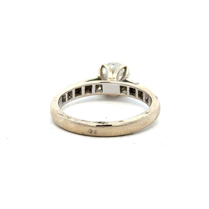 18ct white gold diamond ring with 1.135 carats, color I, clarity SI1, featuring a sparkling central diamond.
