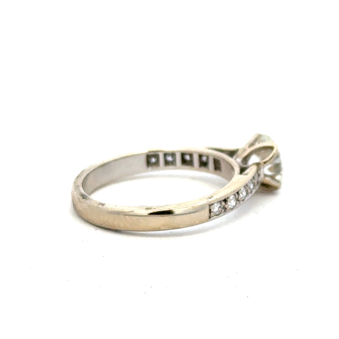 18ct white gold diamond ring with 1.135 carats, Colour I, Clarity SI1, showcasing a sparkling central diamond.