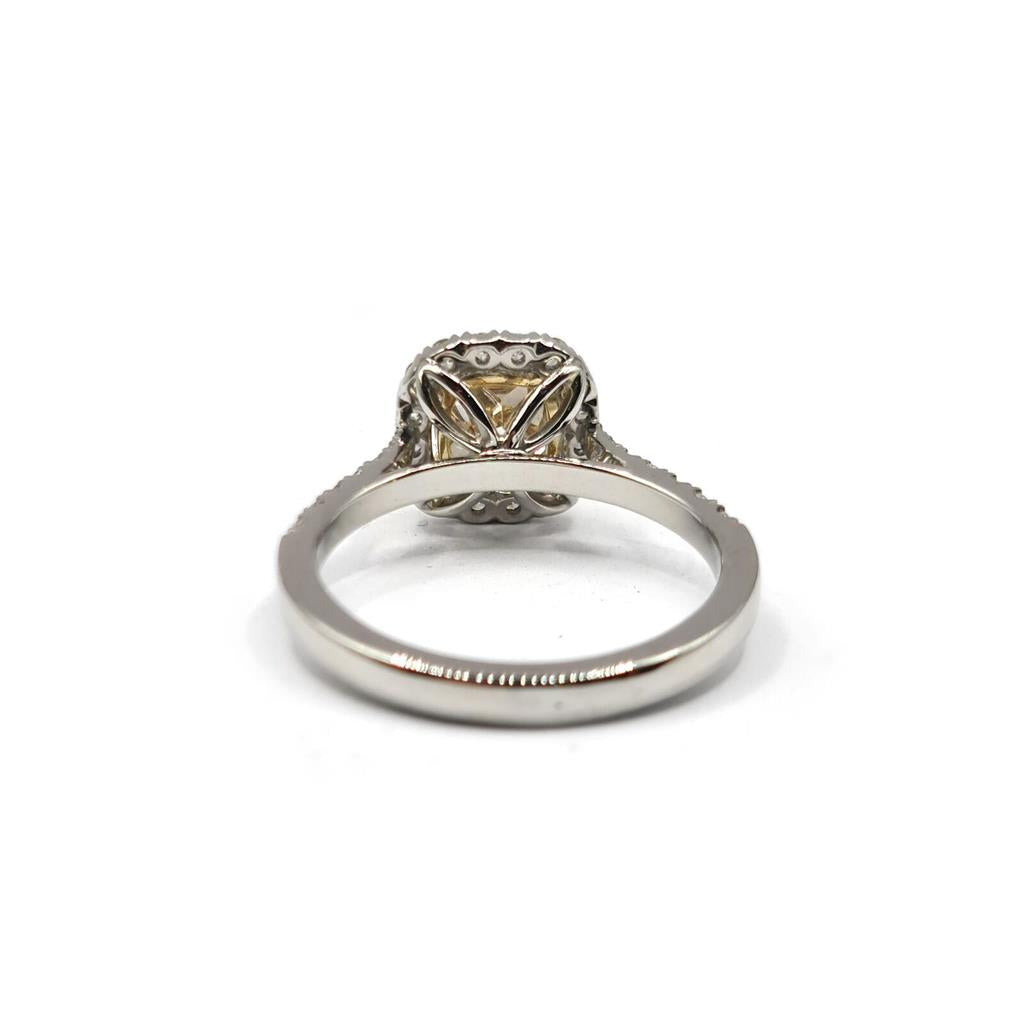18ct white gold ring featuring a 1.15 carat fancy yellow diamond and additional 0.60 carat diamonds with VS1 clarity.