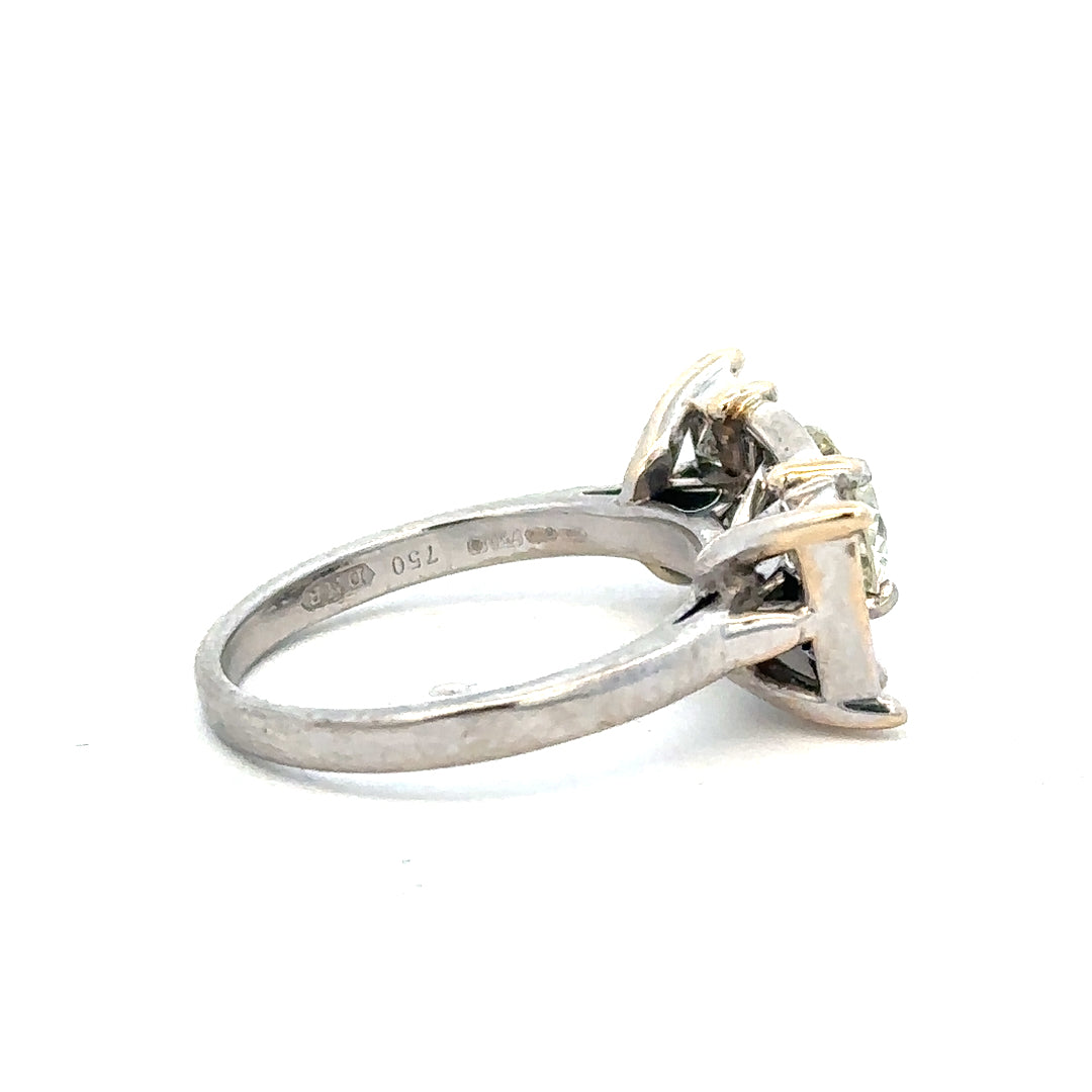 18ct white gold diamond ring with a 1.35 carat sparkling central diamond, elegant jewelry piece.