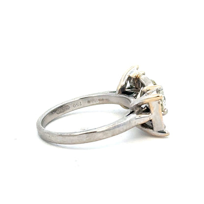 18ct white gold diamond ring with a 1.35 carat sparkling central diamond, elegant jewelry piece.