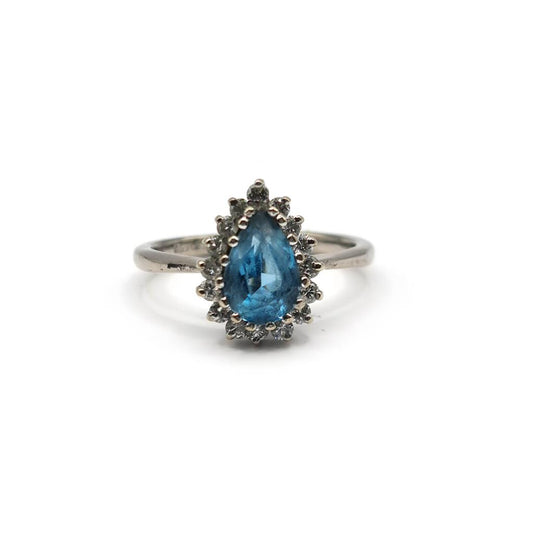 18ct white gold ring with a 1.90 carat pear-shaped topaz and 0.40 carat diamond accent, elegant jewelry piece.