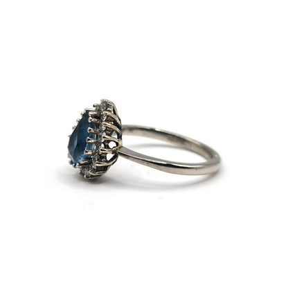 18ct white gold ring with a 1.90 carat pear-shaped topaz and 0.40 carat diamond accents, elegant jewelry piece.