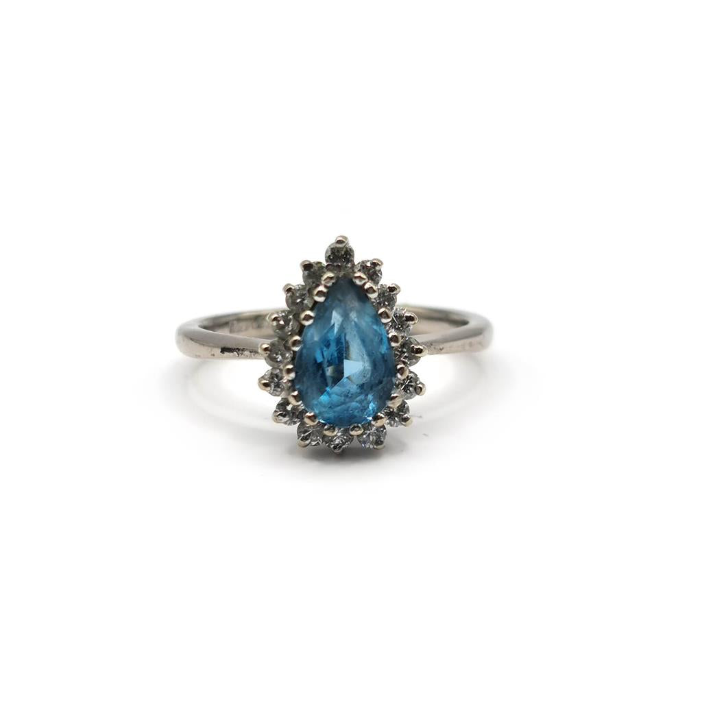 18ct white gold ring with a 1.90 carat pear-shaped topaz and 0.40 carat diamond accents showcasing elegant jewelry design