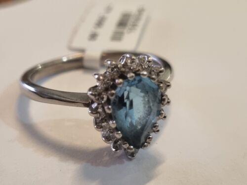 18ct white gold ring featuring a 1.90 carat pear-shaped topaz and 0.40 carat diamonds, elegant jewelry with intricate design.